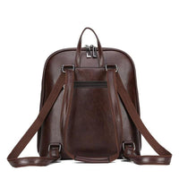 Sac à dos classique marron foncé, vue de face avec poche avant et sangles