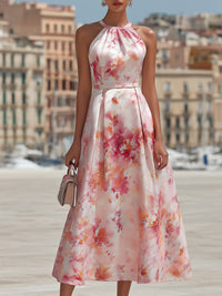 Robe midi rose à fleurs, encolure haute dos nu, taille cintrée, jupe évasée