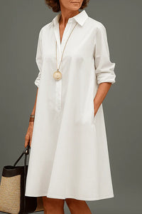 Robe midi chemise blanche unie, col, patte de boutons, manches 3/4, coupe droite.