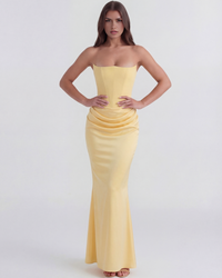 Robe jaune sans manches, buste structuré et fronces à la taille, longue coupe sirène