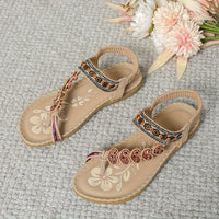 Sandales orthopédiques beiges, bride ajustable avec décorations florales et strass.