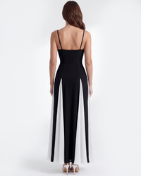 Robe Porto Fino noire vue de dos, fines bretelles, fentes latérales blanc cassé