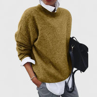 Pull ample col rond kaki en maille, manches longues et coupe ample décontractée.