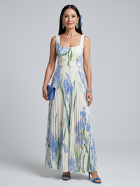 Robe midi sans manches blanche à fleurs bleu et vert, taille marquée et jupe plissée