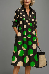 Robe midi noire à pois crème et vert, col, patte de boutons, manches 3/4.