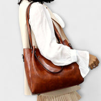 Cabas en cuir marron vintage avec anse longue et poche, sac assorti
