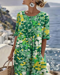 Robe midi ample fleurie verte, encolure ronde, manches courtes, à plis