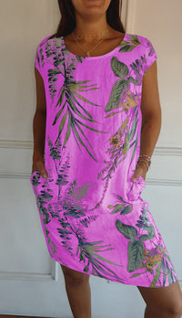 Robe midi à manches courtes, encolure ronde, fond rose fuchsia avec motif végétal