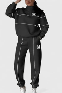 Ensemble pull et pantalon noir à lignes blanches, logo M sur poitrine et jambe