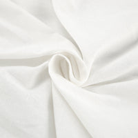 Tissu blanc froissé, haut à nœud et col à volants