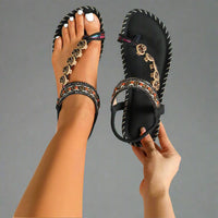 Sandales orthopédiques noires à brides décoratives et semelle cousue, bout ouvert
