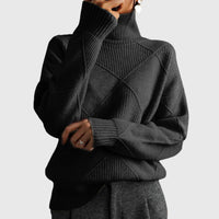 Pull col roulé noir à motif géométrique, manches longues et côtes côtelées.
