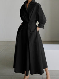 Robe longue noire manches bouffantes, col V, ceinture nouée, jupe ample mi-mollet