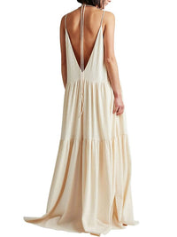 Robe longue écru dos nu, bretelles croisées, encolure V dans le dos et volants