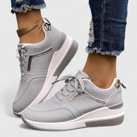 Chaussures orthopédiques grises à lacets, empiècement doré et semelle blanche