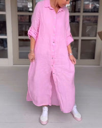 Robe-chemise rose fuchsia boutonnée, col et poignets relevés, longueur mi-mollet