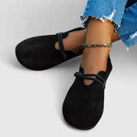 Mocassins orthopédiques noirs à bride élastique et bout arrondi.