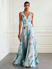 Robe longue bleue à décolleté croisé, taille ceinturée, imprimé fleurs