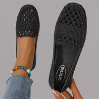 Mocassins Ida™ noirs en crochet ajouré, semelle intérieure avec logo.