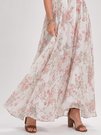 Robe midi fluide imprimée floral, jupe évasée, ourlet ample.