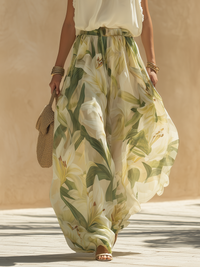 Jupe longue fluide à motif floral vert et jaune, taille élastique, plis légers