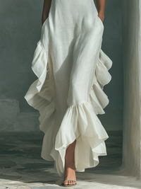 Robe longue ivoire sans manches, volants asymétriques en cascade à l’ourlet