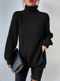 Pull col roulé noir en maille texturée, manches longues, coupe ample, poignets côtelés