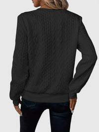 Pull à zip discret noir, vue dos, manches longues, maille torsadée