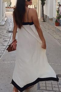 Robe longue blanche à bretelles spaghetti, dos nu avec empiècement noir