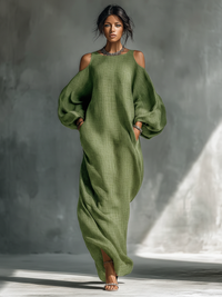 Robe longue vert clair à manches bouffantes, encolure ronde, tissu effet lin.