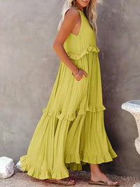Robe sans manches vert clair, volants superposés et poches latérales