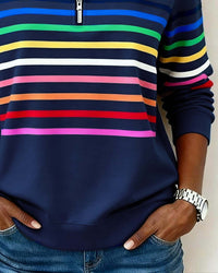 Haut sweat demi-zip bleu nuit à rayures colorées, manches longues et zip au col.