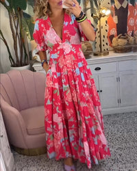 Robe longue rouge à col en V, manches bouffantes, imprimé floral, tombé ample.