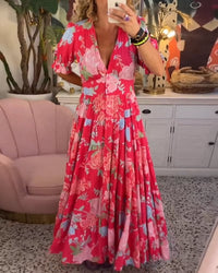 Robe longue rouge à col en V, manches bouffantes, imprimé floral.