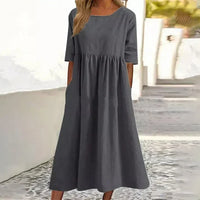 Robe midi grise en lin-coton, encolure ronde, manches courtes, taille froncée.