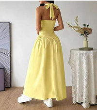 Robe longue jaune dos nu, nœud au dos, taille froncée, jupe ample