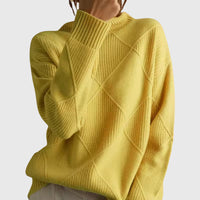 Col roulé en maille jaune à motif géométrique croisé, manches longues et côtes épaisses