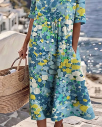 Robe midi ample fleurie bleu clair, coupe évasée, manches courtes