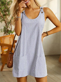 Robe courte rayée bleu et blanc à bretelles boutonnées, poches