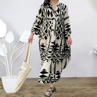 Robe-chemise noire et blanche à motifs géométriques, col chemise, coupe ample.