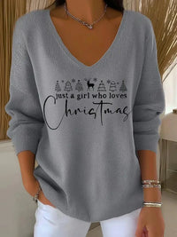 Pull gris à encolure V, sapins en ligne et lettrage de Noël