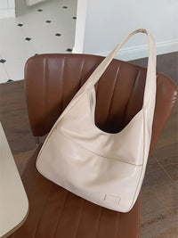 Sac porté épaule crème en cuir, anses longues, poche plaquée et couture