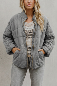 Veste matelassée grise à fermeture zippée, poches et col montant