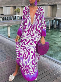 Robe longue à col en V violette à motif abstrait, manches longues et fente.