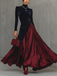 Robe de soirée en velours bicolore bleu nuit et rouge bordeaux, manches longues, drapé