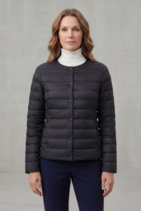 Veste matelassée légère noire, fermeture à boutons, surpiqûres, manches longues