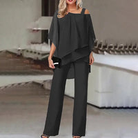 Ensemble deux pièces noir : haut drapé épaules dénudées et pantalon large évasé