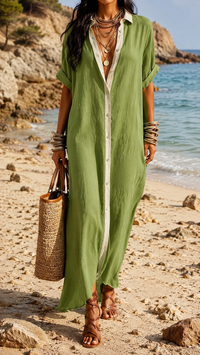 Robe longue verte boutonnée, encolure V, manches courtes, tissu léger, fente latérale.