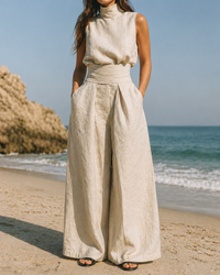 Ensemble sans manches en lin beige clair, haut col montant et pantalon large noué à la taille