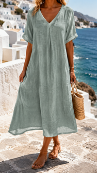Robe ample vert clair, encolure en V, manches courtes, silhouette fluide.